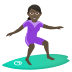 🏄🏿‍♀️ woman surfing: dark skin tone display on JoyPixels